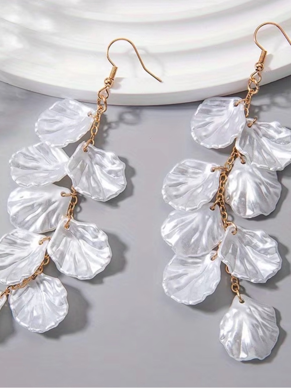 shimmering shell and scallop-shaped charms